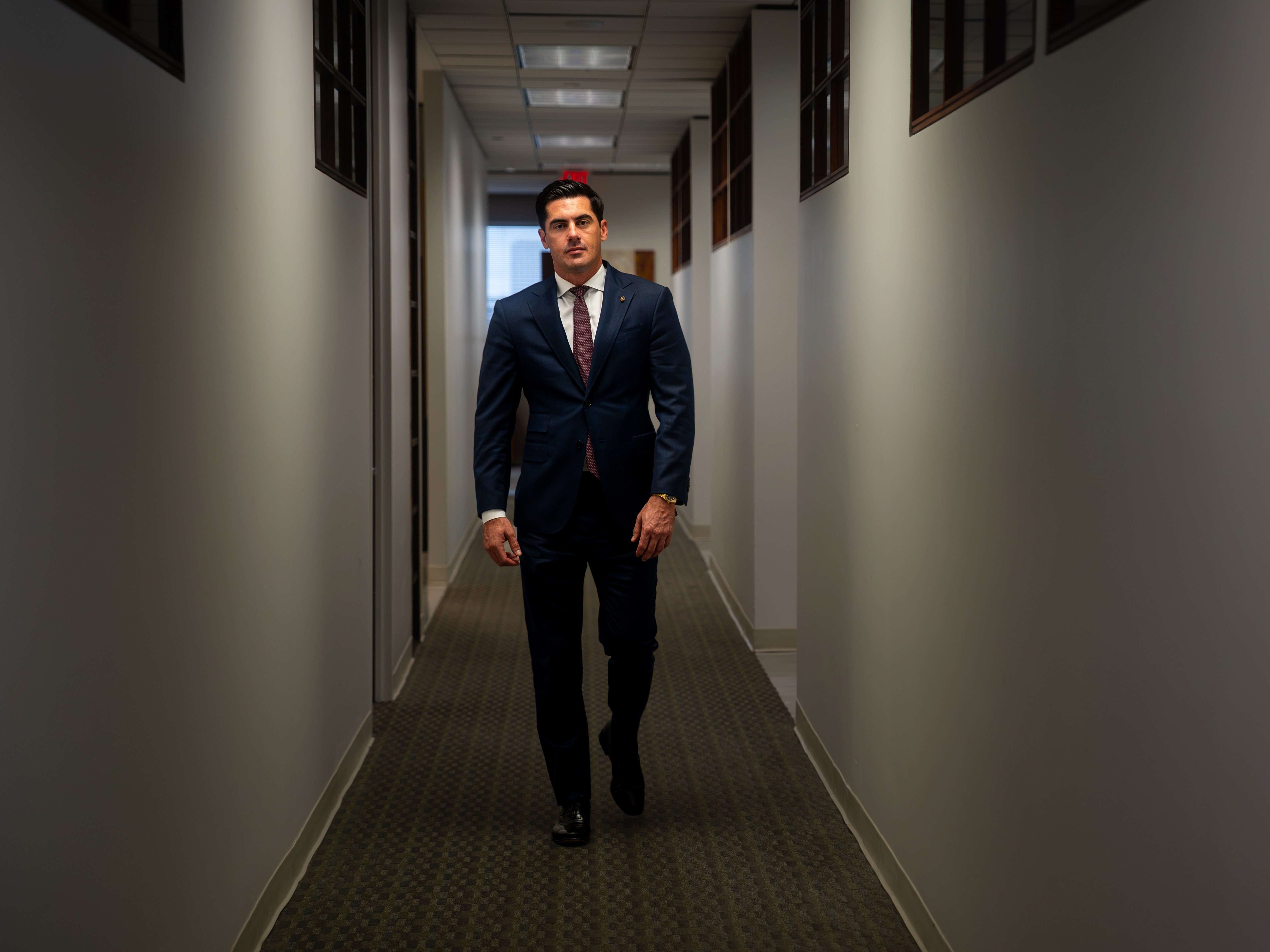 Brandon Cammack walking through the offices of Cammack Law Firm in Houston